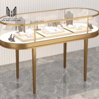 TGN V06- MẪU TỦ CONG CHÂN INOX 201 MẠ PVD VÀNG GIỮA NHÀ CHO TIỆM VÀNG